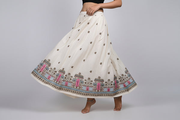 White dress with intricate embroidery on a white background