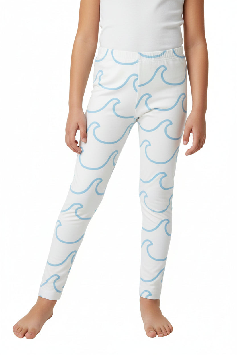 White pants with blue wave pattern on a red patterned fabric background