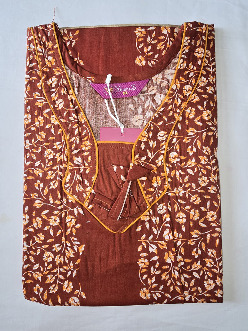 Brown floral-patterned top with a visible brand tag on a light gray background