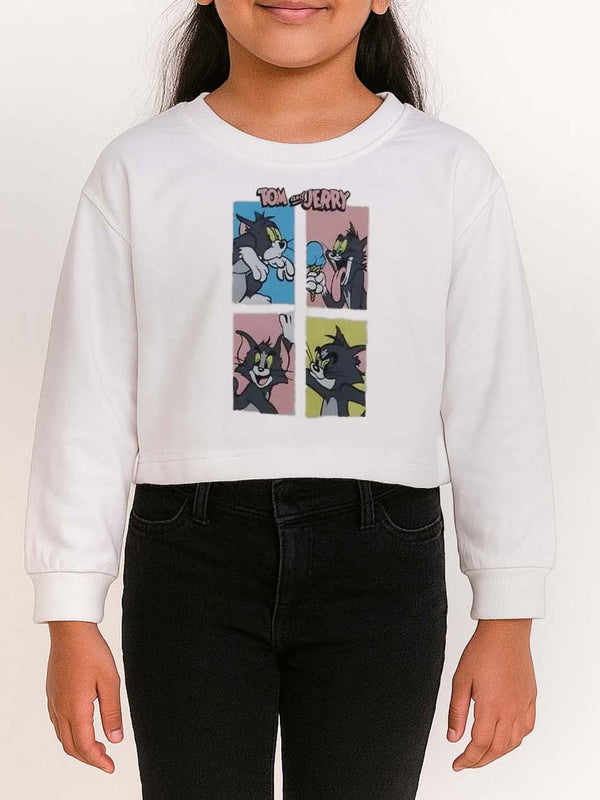 Child wearing a white sweatshirt with cartoon character design on a plain background