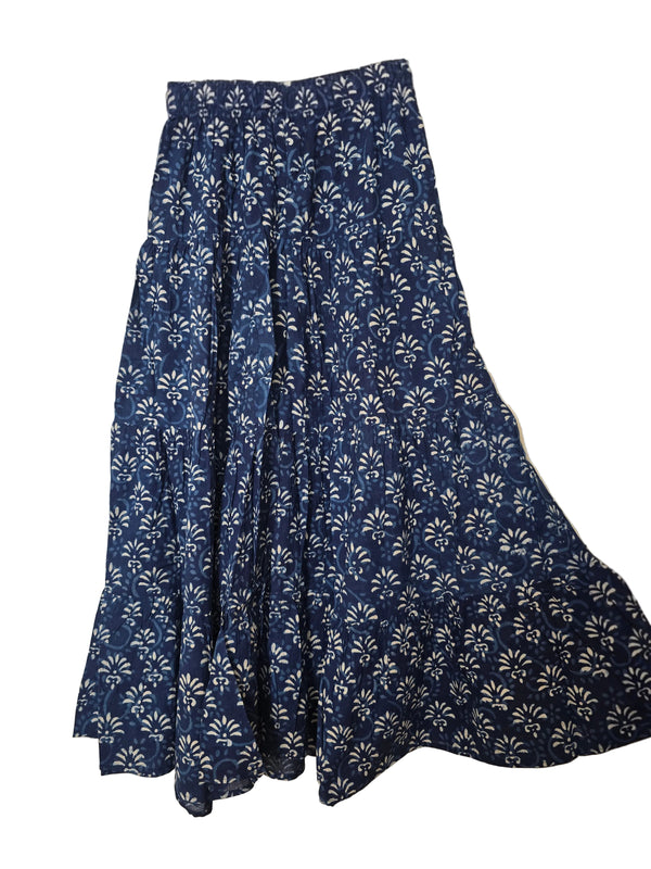 Blue floral patterned skirt on a beige background