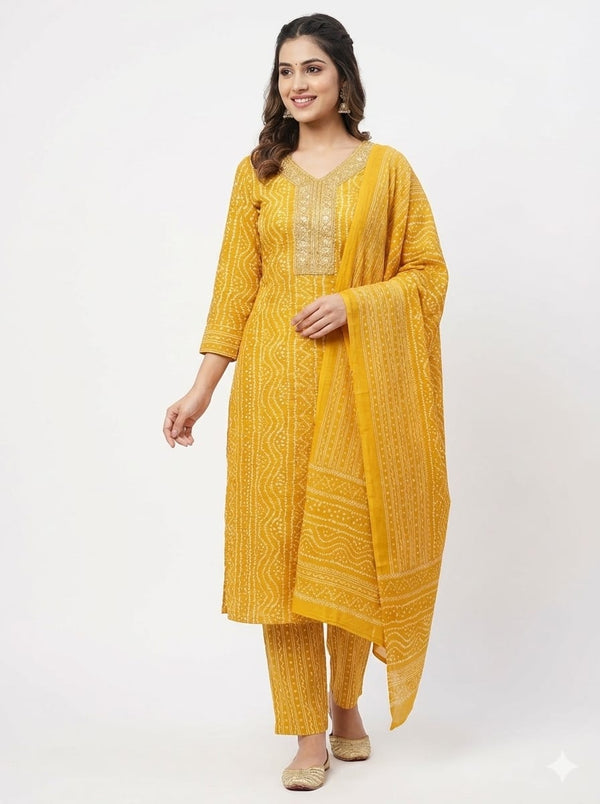 Woman wearing a yellow traditional outfit with a matching dupatta on a white background