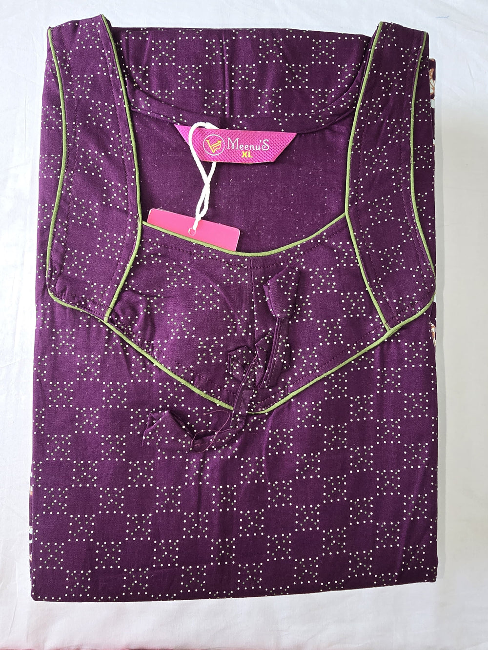 Purple garment with white star pattern on a white background