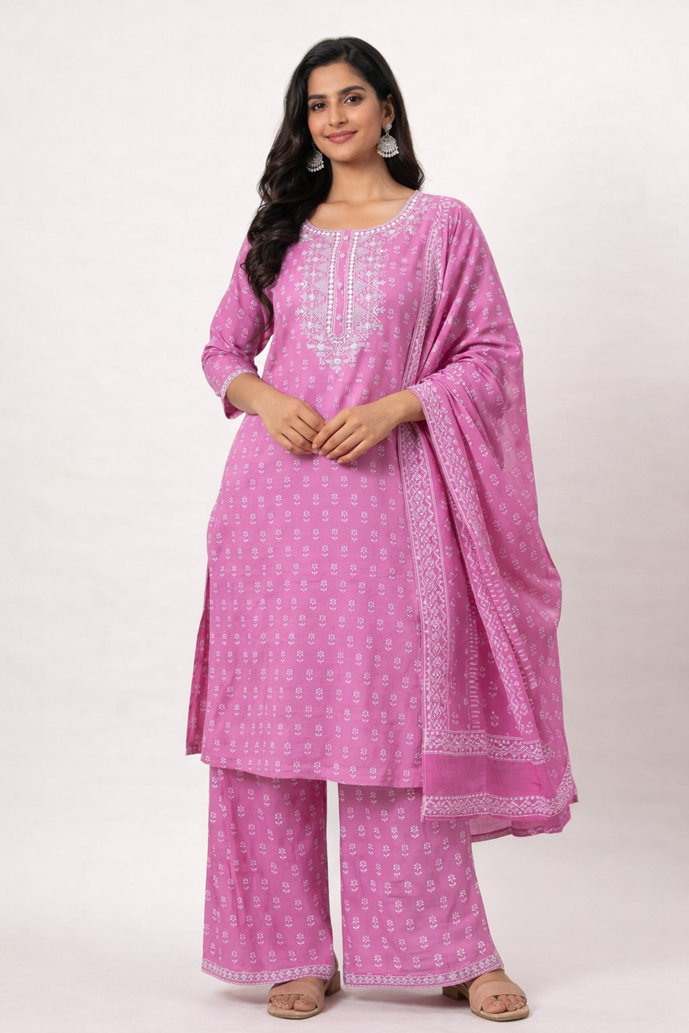 Woman wearing a pink traditional outfit with a white background